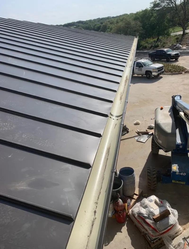 Standing seam panel and gutter detail on a metal roofing jobsite in Tuckahoe